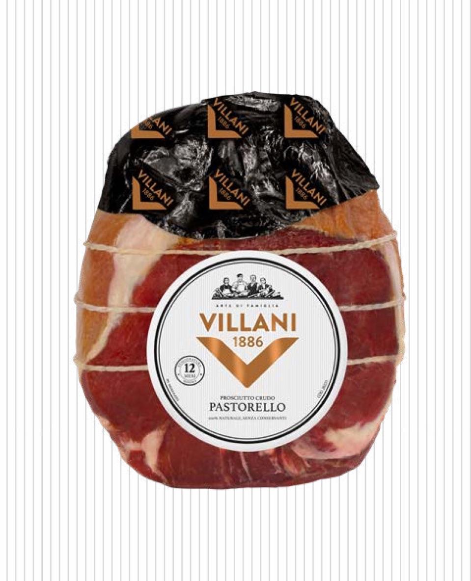 Ganze Rohschinkenkeule Pastorello von Villani, luftgetrocknet, mit schwarzer Verpackung und rundem Etikett mit Aufschrift ‚Villani 1886 Pastorello